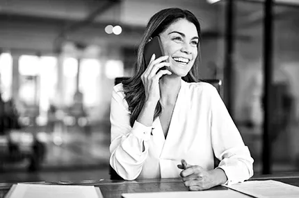 Business woman talking on the phone in her office